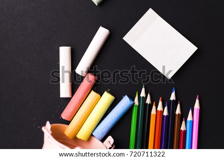 Pencils, crayons, magnifying glass. School.
