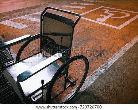 Empty wheelchair parking lot on the symbol in hospital.