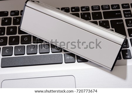 Laptop keyboard with blank sign for your text