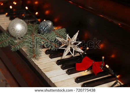 New year decorations on piano keyboard. Christmas music concept