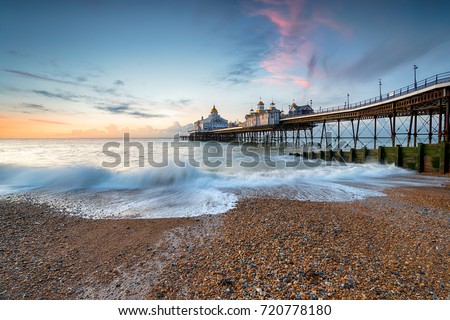 Dawn at Eastbourne Pier in  East Sussex on the south coast of England Royalty-Free Stock Photo #720778180