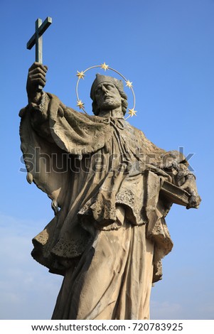 Baroque Statue of Saint John of Nepomuk on old Main Bridge in Wurzburg. Franconia. Germany
