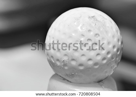Image of a hockey ball. This image was blurred or selective focus. Black and white picture.