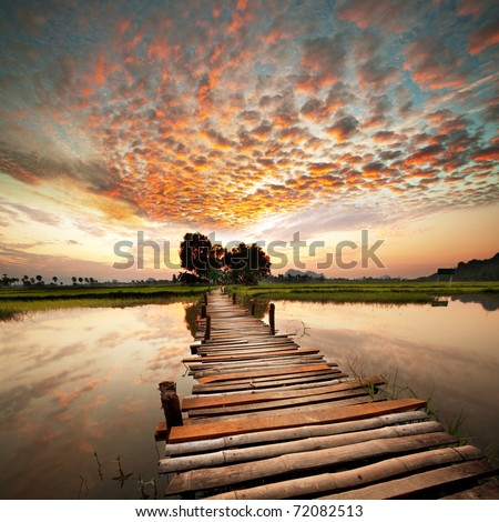 sunset on the tropical river Royalty-Free Stock Photo #72082513