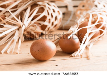 Organic egg on wooden background.