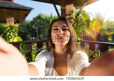 Pretty Woman Blowing Kiss Taking Selfie Photo Young Girl Make Self Portrait Outdoors Over Natural Background