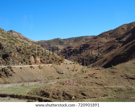 Road at high ATLAS MOUNTAINS range landscape in MOROCCO near Tizi-n-Tichka pass in central part of country with clear blue sky in 2017 warm sunny winter day, northern AFRICA on February.