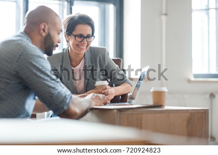 Successful professionals looking through online ideas for their business project Royalty-Free Stock Photo #720924823