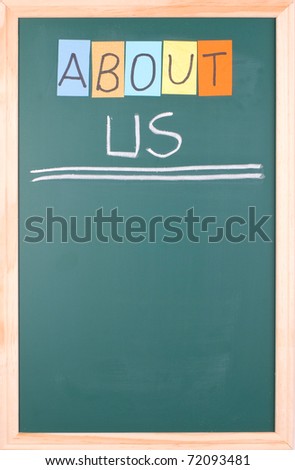 About us, colorful word on blank blackboard