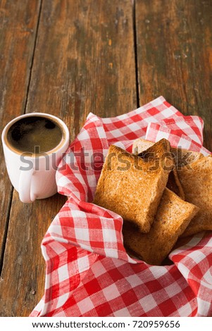 Breakfast background, toast and coffee on rustic wood. Espresso and bread