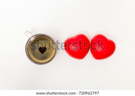 Cup of coffee with hearts on white table. Top view with copy space. Valentine's day background