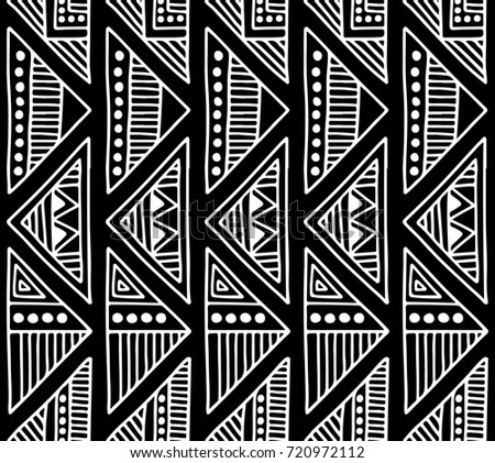 Seamless pattern. Black and white geometrical background with hand drawn decorative tribal elements. Print with ethnic, folk, traditional motifs. Graphic illustration.