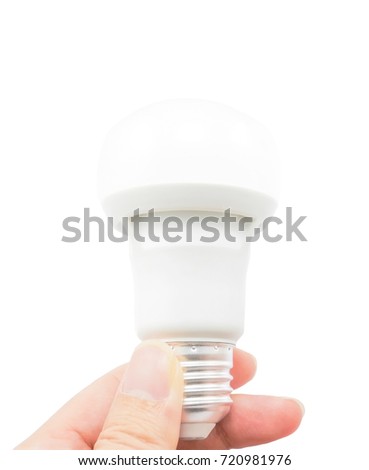 Hand grab a LED light bulb on white background - Energy and power concept