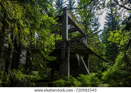 Old dirty broken ruined abandoned building among Bog, Facade ruins of industrial factory Royalty-Free Stock Photo #720982543