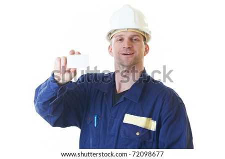 Smiling builder man in blue robe with visit card isolated on white