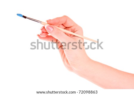Paint brush in hand isolated on white