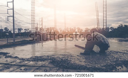Silhouette of construction worker background
