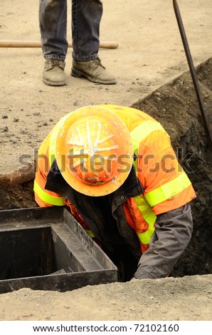 Putting in a drain pipe to a parking lot catch bin in a new commercial development in Roseburg Oregon