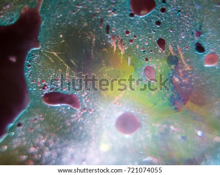 Painted oil drops on the water, backlighting from different directions, large magnification, bokeh, Colored abstractions