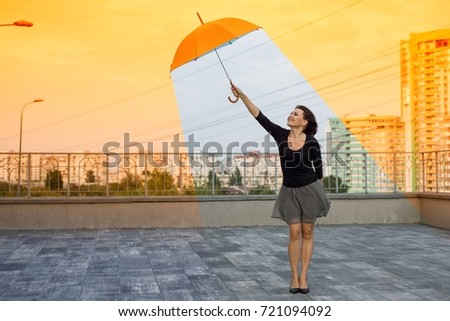 Global warming woman holding an umbrella is in a comfortable climate