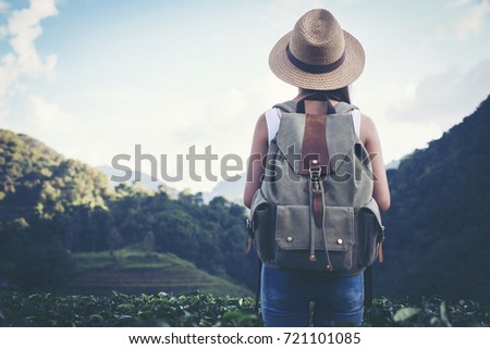 happy female tourist to travel in wild trip  hiking during vacation.Travel concept.