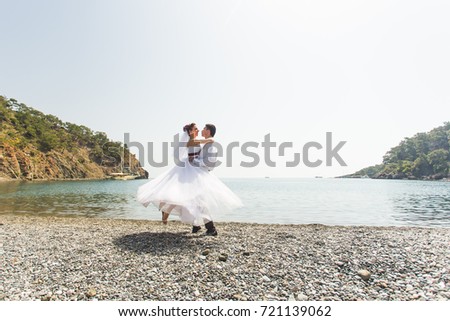 beautiful gorgeous bride and stylish groom on a beach