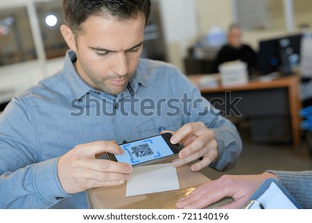business man holding smart phone