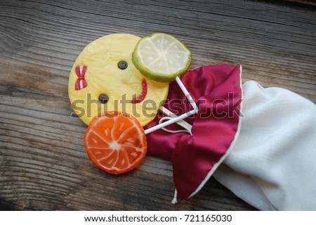 lollipops, colorful.
in a bag on a wooden table