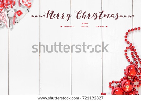 Christmas and New Year background with thuja branch, decorations and presents wrapped in craft paper with snowflakes. Flat lay, top view.