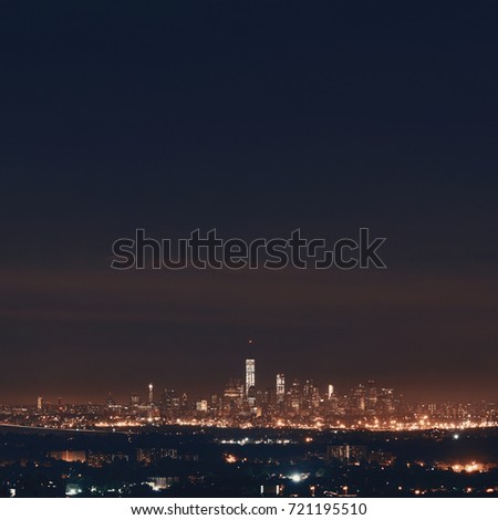 New York City skyline at night with downtown urban skyscrapers