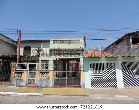 An horizontal picture of a facade of a typical suburban house in São Paulo  Brazil on a sunny day,
