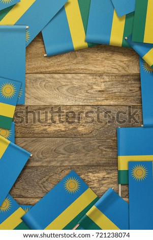 small flags framing a wood texture background with copy space