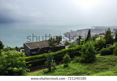 Embankment of Geneva Lake in Montreux, Swiss Riviera. Alps mountains on the background, Switzerland, Europe.