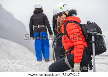 Picture of asian woman travel enjoy and walking glacier in Iceland, summertime