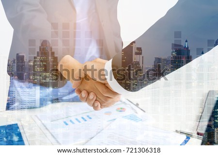 Double Exposure Partners Business and Building, Business Handshake and Collaboration of Partners and Sponsors who are faithful. Confidence as Well as Coming Together is a Key part of Success Royalty-Free Stock Photo #721306318