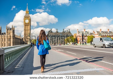 London city urban lifestyle tourist woman walking. Businesswoman commuting going to work on Westminster bridge street early morning. Europe travel destination, England, Great Britain, UK. Royalty-Free Stock Photo #721322320