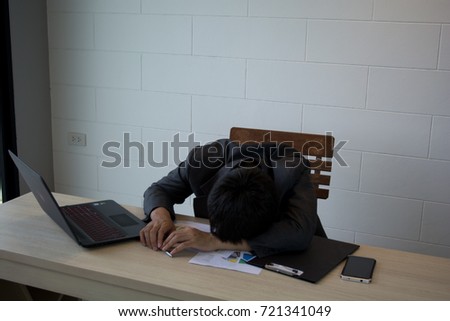 Sleeping young man working on computer