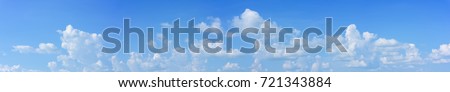 panoramic sky with white clouds Royalty-Free Stock Photo #721343884