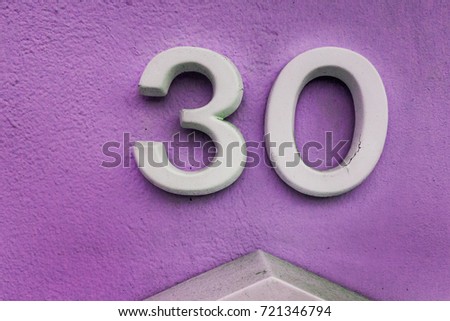 number 30 House number on the wall thirty (30)