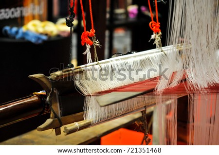 The Complex Thai Silk Making Process The silkworms, This process is called “sericulture.” The most valuable silk yarn is obtained from a silkworm, Household handicrafts of Thai silk Royalty-Free Stock Photo #721351468
