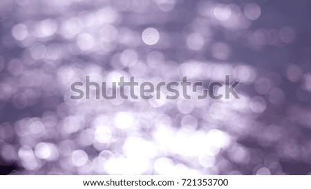 Beautiful abstract purple glittering lights bokeh background