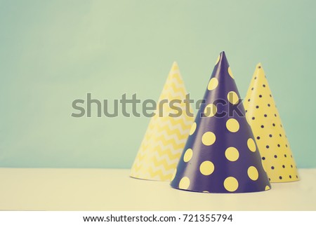 holidays background with birthday hats in vintage color
