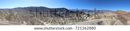 Panorama photo of the great landscape of Death Valley with dramatic cloudy sky. Desert. USA, California.