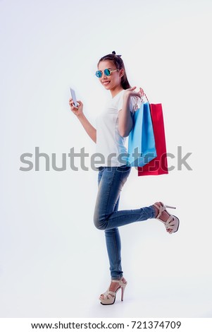 Pictures of beautiful cheerful girls in summer dress, holding dollar bills with shopping bags and looking at camera through white background.