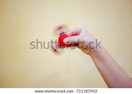 Fidget spinner in the child hand