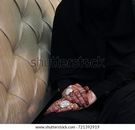 Bride- beautiful muslim bride hands with henna and ring (mehndi hands)