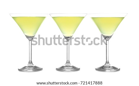 Glasses of lemon drop martini on white background