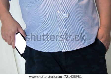 the man picks up a text message on a mobile phone. fat man,
