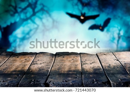 Halloween theme of wooden boards with bats in background
