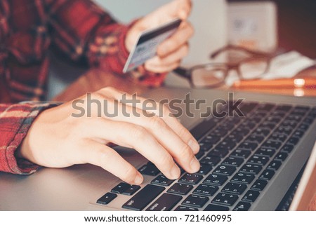 Man hand holding  credit card using keyboard laptop  online banking.  shopping online